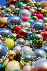 Fototapeta na wymiar Shiny golden, red, blue, silver and pink Christmas balls as background.