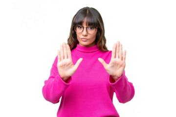 Young caucasian woman over isolated background making stop gesture and disappointed