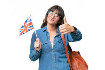 Young caucasian woman holding an United Kingdom flag over isolated background with thumbs up because something good has happened