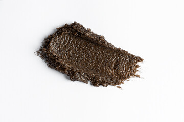 A smudge swatch smear of coffee scrub for body care. Product presentation. Cosmetic close up