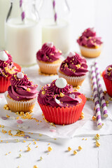 Delicious and homemade red cupcakes made with golden sprinkles.