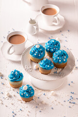 Delicious and sweet cupcakes with flower shaped cream.