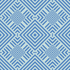 Ethnic geometric patterns: vibrant textiles with zigzag lines and psychedelic shapes.Light blue ethnic interiors: ikat textiles and tartan patterns in a contemporary geometric style