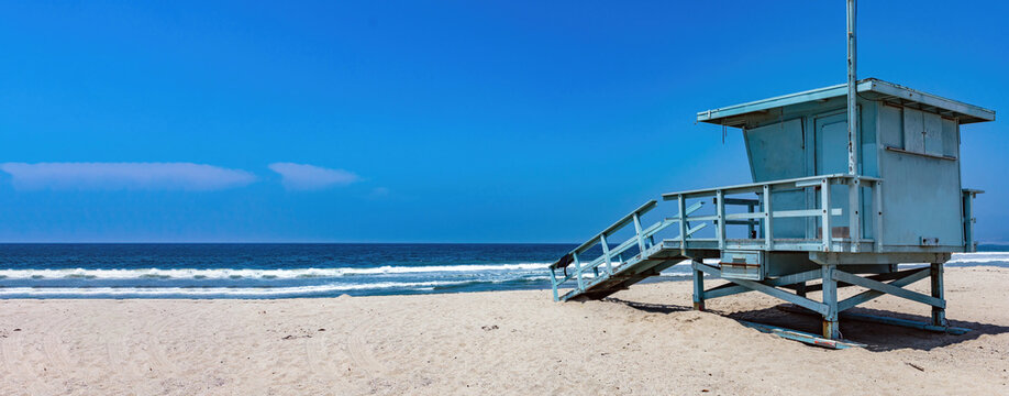 Lifeguard Tower on empty sandy Venice beach Los Angeles California USA. Sky, sea, copy space. Banner