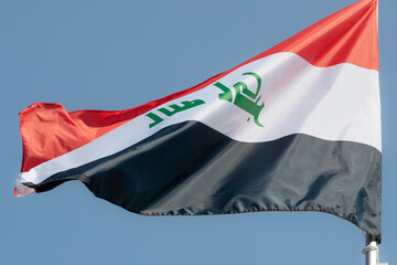 National flag of Iraq for advertising, celebration, achievements, festivals, elections. Iraq national flag flutters in the beautiful sky. great news.