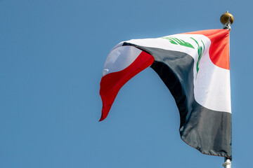 National flag of Iraq for advertising, celebration, achievements, festivals, elections. Iraq national flag flutters in the beautiful sky. great news.