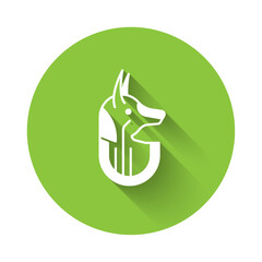 White Egyptian anubis icon isolated with long shadow background. Green circle button. Vector