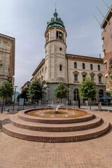 Fototapeta na wymiar The fountain in the Piazzetta della Posta in the historic center of Lugano, Switzerland