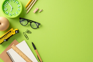 Engage in the dynamic process of education with this top-view composition showcasing a child's workplace.Blank notepad and stationery on isolated light green background, providing room for text or ad - Powered by Adobe