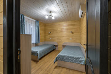 interior of wooden eco bedroom in studio apartments,  hostel or homestead