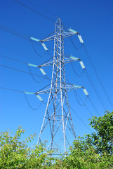 Lattice Steel Electricity Grid Supply Pylon seen against Blue Sky