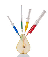 A pear with a syringe filled with chemicals