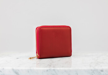 Luxury women 's handbag, wallet. Luxury red leather handbag on white background, on marble floor. Fashionable trendy accessory
