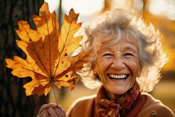 happy grandmother holding a leaf in autumn sunset, generative ai