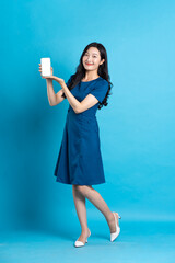 Portrait of beautiful woman in blue dress, isolated on blue background