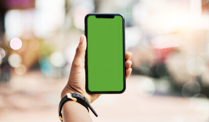 Phone, green screen and person hands in city for social media, advertising and website ui or ux design mockup. Mobile app, technology and people with smartphone space for outdoor or urban travel
