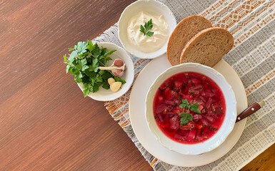 Borscht beet soup with bread and sour cream