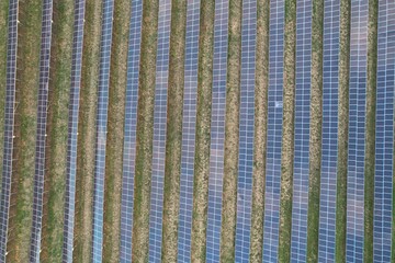 Modern solar power plant, photovoltaic panels green energy electricity production,new power plant, European energy crisis 2022, green deal,Czech republic,European Union,aerial panorama landscape view	