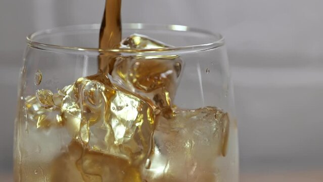 cold drink video: cola pour in glass