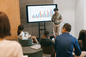 Businesspeople having a presentation at small amphitheater