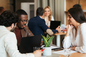 Three work friends sat together at the cafeteria