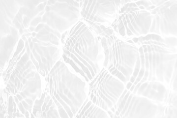 White water with ripples on the surface. Defocus blurred transparent white colored clear calm water surface texture with splashes and bubbles. Water waves with shining pattern texture background.