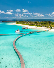 Beautiful Maldives paradise. Tropical aerial travel landscape, seascape wooden bridge pier, water villas, amazing sea coast sky beach, tropical island nature. Exotic destination, best summer vacation