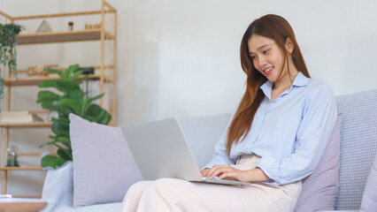 Home office concept, Businesswoman reading data on laptop to analysis marketing plan of startup