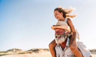 Cheerful grandfather and granddaughter bonding outdoors on sunny summer day