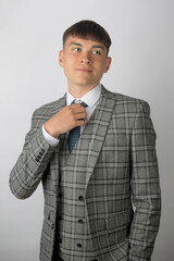 Young entrepreneur in a suit, tie and waistcoat