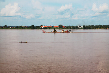 Fototapeta na wymiar sand suction boat the Mekong River in Ubon Ratchathani Province, Thailand