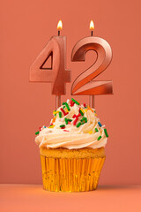 Birthday cake with candle number 42 - Coral fusion background