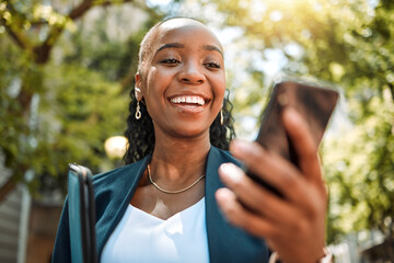 Happy black woman, phone and city for social media, communication or online browsing at the park....