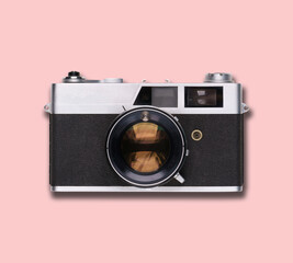 vintage old film camera on pink background