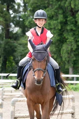 Foto op Canvas 乗馬を楽しむ女の子 © hakase420