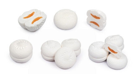 Sweet white round marshmallows and orange filling on a white background. Sweets. dessert.