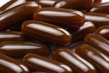 Sunflower lecithin in capsules background. Lecithin in brown capsules close up. alternative medicine, medicinal product