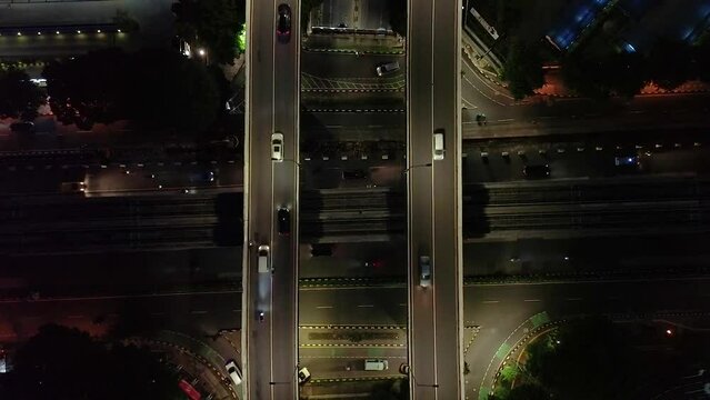 Topdown night aerial view of street overpass