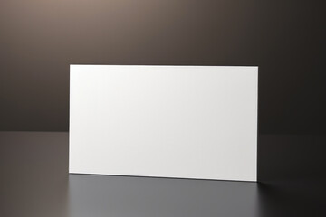 blank business card on black wall background