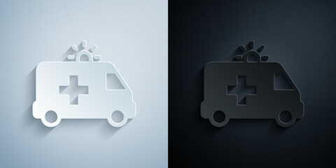 Paper cut Ambulance and emergency car icon isolated on grey and black background. Ambulance vehicle medical evacuation. Paper art style. Vector © Iryna
