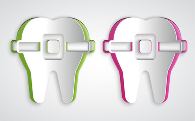 Paper cut Teeth with braces icon isolated on grey background. Alignment of bite of teeth, dental row with with braces. Dental concept. Paper art style. Vector