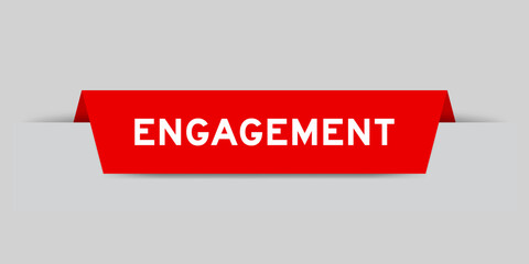 Red color inserted label with word engagement on gray background