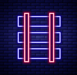 Glowing neon line Railway barrier icon isolated on brick wall background. Colorful outline concept. Vector