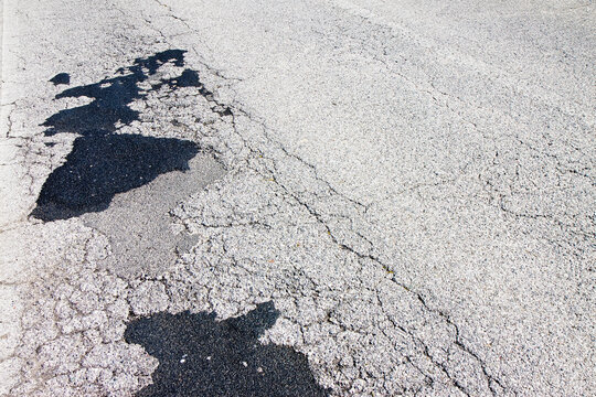 Old damaged asphalt road background