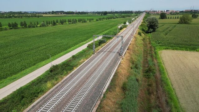 Europe, Italy , Milan - Frecciarossa Hight speed 300km h train raylway from Milano  to Rome view from the drone - the faster way to travel in Italy for tourist and passengers - tourist destination 