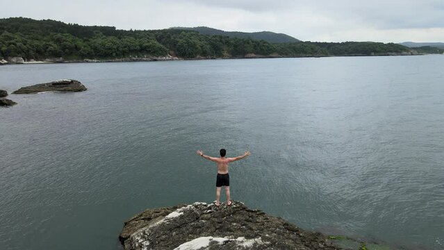 free man on cliff