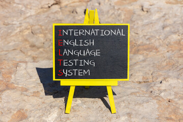 IELTS symbol. Concept words IELTS international english language testing system on black...