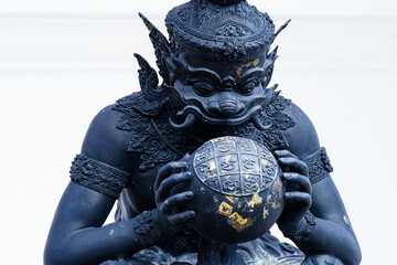 Phra Rahu the name of Thai and India god, The black giant eating the moon. Phra Rahu statue At...