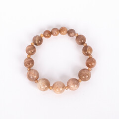 Beige natural stone, Sunstone bracelet. Three different sizes of the stones and small crystals between.