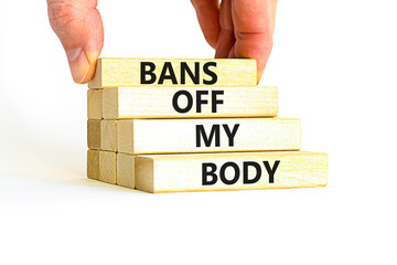 Bans off my body symbol. Concept words Bans off my body on wooden blocks on a beautiful white table white background. Women rights concept. Business social issues and bans off my body concept.